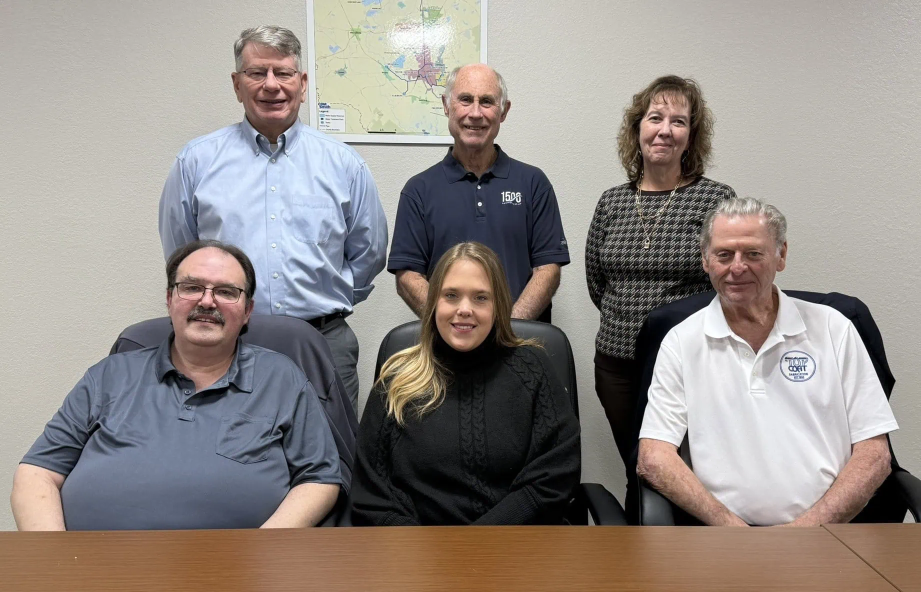A photo of the board of directors. 2026 Board Members are: (Seated L-R) Jesse Knight, Amy Condon, Kenny Hayes (Standing L-R) Tom Normand, Cecil Booth, Elizabeth Cooper